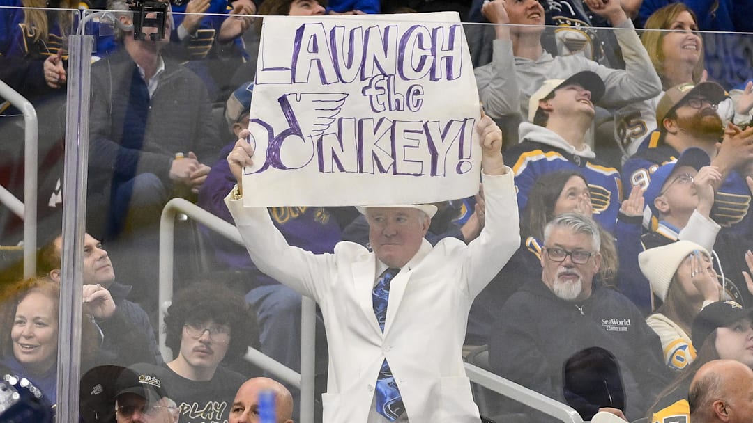Apr 3, 2025; St. Louis, Missouri, USA;  St. Louis Blues fans holds up a sign during the second period against the Pittsburgh Penguins at Enterprise Center. Mandatory Credit: Jeff Curry-Imagn Images