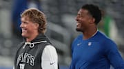 Oct 9, 2025; East Rutherford, New Jersey, USA; New York Giants quarterback Jaxson Dart, left, and quarterback Jameis Winston, right, on the field before the game against the Philadelphia Eagles at MetLife Stadium.  