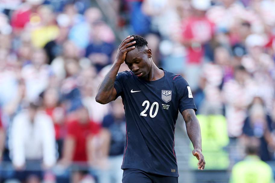 Folarin Balogun rubbing his head.