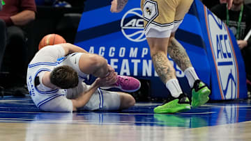 Mar 13, 2025; Charlotte, NC, USA; Duke basketball forward Cooper Flagg (2) is injured in the first half at Spectrum Center. Mandatory Credit: Bob Donnan-Imagn Images
