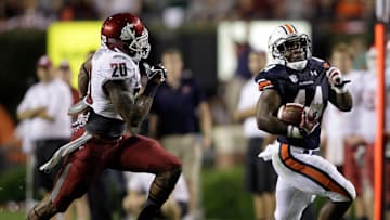 Aug 31, 2013; Auburn, AL, USA; Auburn Tigers running back Cameron Artis-Payne (44) is chased by Washington State Cougars safety Deone Bucannon (20) during the second half at Jordan Hare Stadium.  The Tigers beat the Cougars 31-24. Mandatory Credit: John Reed-Imagn Images