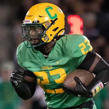 Nigel Nelson (23) carries the ball during the Navarre vs Catholic football game at Pensacola Catholic High School on Friday, Aug. 23, 2024.