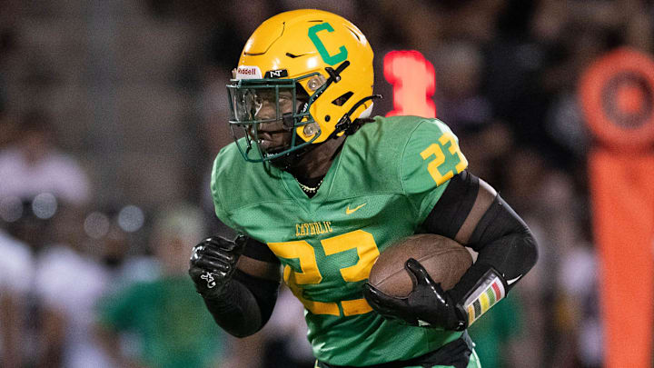 Nigel Nelson (23) carries the ball during the Navarre vs Catholic football game at Pensacola Catholic High School on Friday, Aug. 23, 2024.