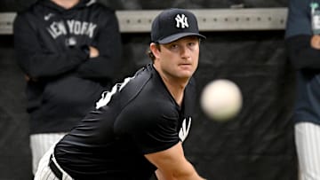 Feb 16, 2025; Tampa, FL, USA; New York Yankees pitcher Gerrit Cole (45)  throws a pitch during spring training at George M. Steinbrenner Field. Mandatory Credit: Jonathan Dyer-Imagn Images