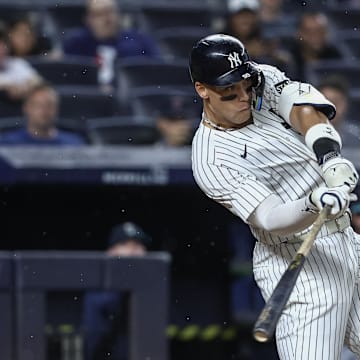 New York Yankees right fielder Aaron Judge (99) hits an RBI double in the sixth inning against the Seattle Mariners at Yankee Stadium on July 9. 
