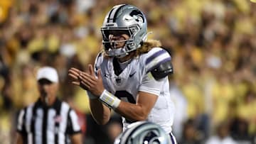 Oct 12, 2024; Boulder, Colorado, USA; Kansas State Wildcats quarterback Avery Johnson (2) calls for the snap during the first half against the Colorado Buffaloes at Folsom Field. Mandatory Credit: Christopher Hanewinckel-Imagn Images