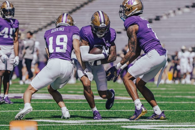 Darren Barkins goes through a fall drill, which seems to involve a touch tackle rather than full contact.