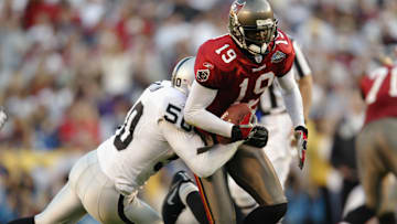 Keyshawn Johnson runs after the catch