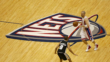 Spurs' Tony Parker defends Nets' Jason Kidd