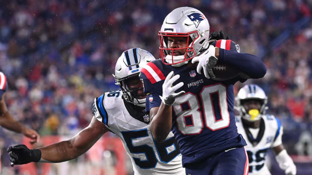 New England Patriots wide receiver Kayshon Boutte (80) runs the ball with Carolina Panthers linebacker Trevin Wallace (56).