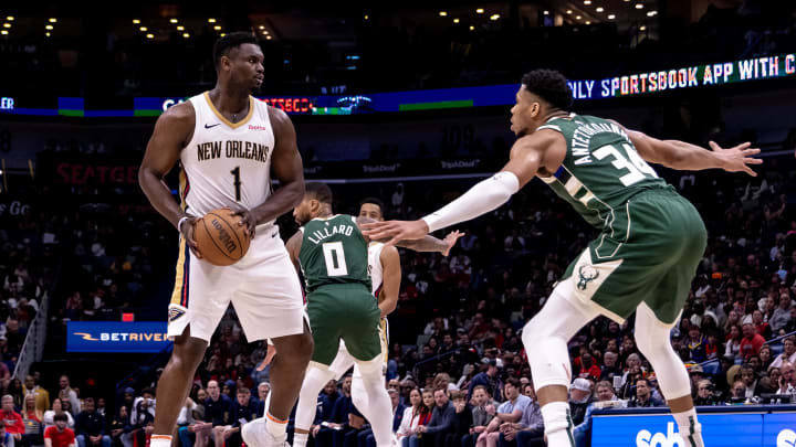 Mar 28, 2024; New Orleans, Louisiana, USA;  New Orleans Pelicans forward Zion Williamson (1) looks to pass the ball against Milwaukee Bucks forward Giannis Antetokounmpo (34) during the second half at Smoothie King Center.