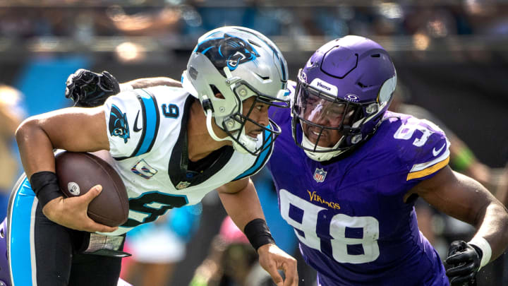 Oct 1, 2023; Charlotte, North Carolina, USA; Minnesota Vikings linebacker D.J. Wonnum (98) sacks Carolina Panthers quarterback Bryce Young (9) in the third quarter at Bank of America Stadium.