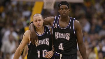 Chris Webber walks with Mike Bibby