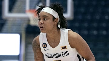 Dec 1, 2024; Estero, FL, USA; West Virginia University Sydney Shaw (5) looks to make a pass in the first quarter of the Women's Gulf Coast Showcase at Hertz Arena. Mandatory Credit: Chris Tilley-Imagn Images