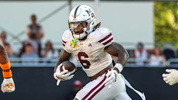 Sep 27, 2025; Starkville, Mississippi, USA; Mississippi State Bulldogs running back Davon Booth (6) runs with the ball against the Tennessee Volunteers during the second half at Davis Wade Stadium at Scott Field. Mandatory Credit: Wesley Hale-Imagn Images