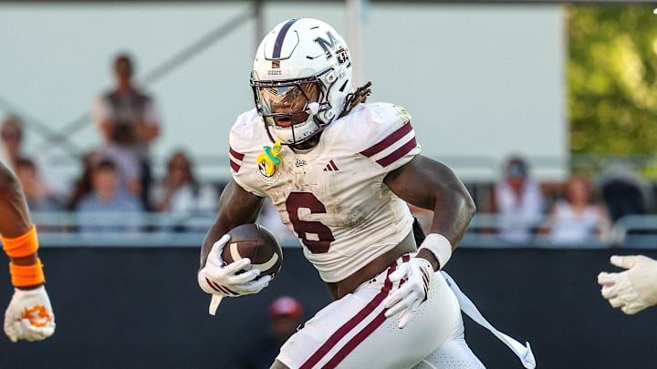 Sep 27, 2025; Starkville, Mississippi, USA; Mississippi State Bulldogs running back Davon Booth (6) runs with the ball against the Tennessee Volunteers during the second half at Davis Wade Stadium at Scott Field. Mandatory Credit: Wesley Hale-Imagn Images