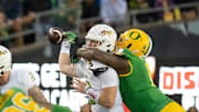 Oregon defensive end Jordan Burch forces a fumble from Maryland quarterback Billy Edwards Jr. as the Oregon Ducks host the Maryland Terrapins at Autzen Stadium Saturday, Nov. 9, 2024 in Eugene, Ore.