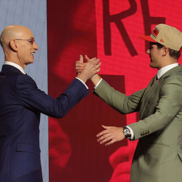 Jun 26, 2024; Brooklyn, NY, USA; Reed Sheppard shakes hands with NBA commissioner Adam Silver after being selected in the first round by the Houston Rockets in the 2024 NBA Draft at Barclays Center. Mandatory Credit: Brad Penner-USA TODAY Sports
