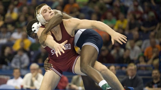 Nick Amuchastegui of the Stanford Cardinal wrestles Edward Ruth of the Penn State Nittany Lions during the finals