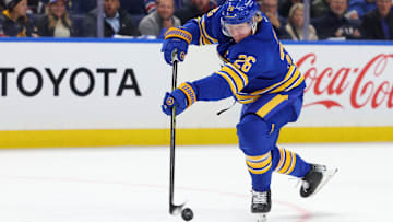 Oct 9, 2025; Buffalo, New York, USA;  Buffalo Sabres defenseman Rasmus Dahlin (26) takes a shot on goal during the first period against the New York Rangers at KeyBank Center. Mandatory Credit: Timothy T. Ludwig-Imagn Images