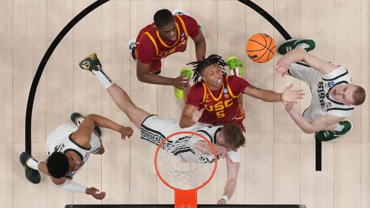 Mar 17, 2023; Columbus, Ohio, USA;  USC Trojans guard Boogie Ellis (5) fights for a rebound with Michigan State Spartans center Carson Cooper (15) and forward Joey Hauser (10) during the first round of the NCAA men   s basketball tournament at Nationwide Arena. Marquette won 78-61. Mandatory Credit: Adam Cairns-The Columbus Dispatch

Basketball Ncaa Men S Basketball Tournament