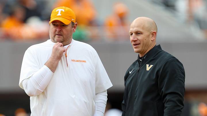 Nov 29, 2025; Knoxville, Tennessee, USA;  Tennessee Volunteers head coach Josh Heupel and Vanderbilt Commodores head coach Clark Lea meet before a game at Neyland Stadium. Mandatory Credit: Randy Sartin-Imagn Images