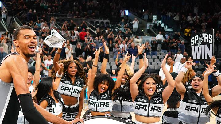 Mar 5, 2026; San Antonio, Texas, USA; San Antonio Spurs forward forward Victor Wembanyama (1) beats a drum and leads fans on a cheer after a victory over the Detroit Pistons at Frost Bank Center. Mandatory Credit: Scott Wachter-Imagn Images