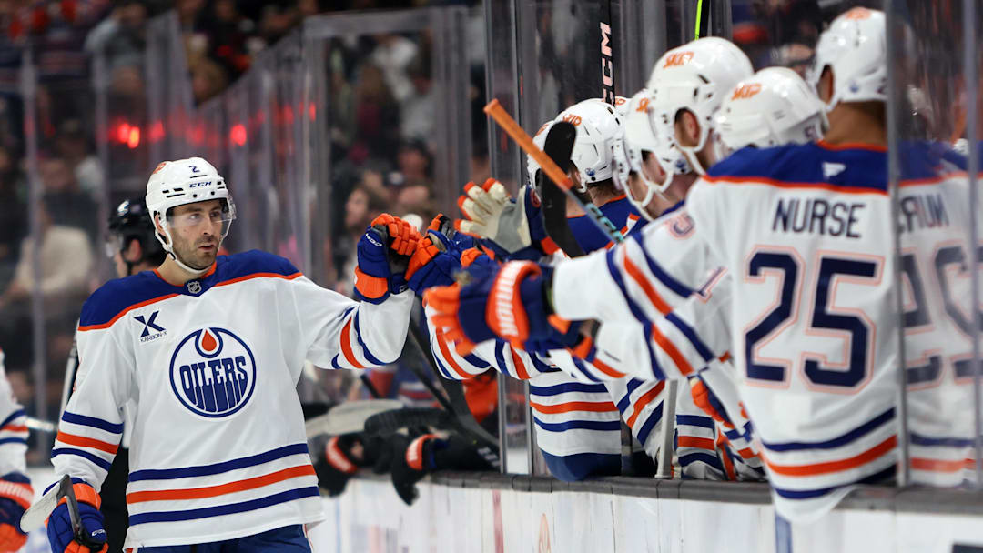 Edmonton Oilers defenseman Evan Bouchard (2) celebrates with teammates. Credit: Kiyoshi Mio-Imagn Images