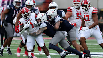 Nov 18, 2023; Tucson, Arizona, USA; Arizona Wildcats safety Gunner Maldonado (9) tackles Utah Utes running back Jaylon Glover (1) during the second half at Arizona Stadium. Mandatory Credit: Zachary BonDurant-Imagn Images