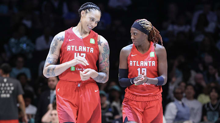 Jun 17, 2025; Brooklyn, New York, USA;  Atlanta Dream center Brittney Griner (42) and guard Rhyne Howard (10) at Barclays Center. Mandatory Credit: Wendell Cruz-Imagn Images
