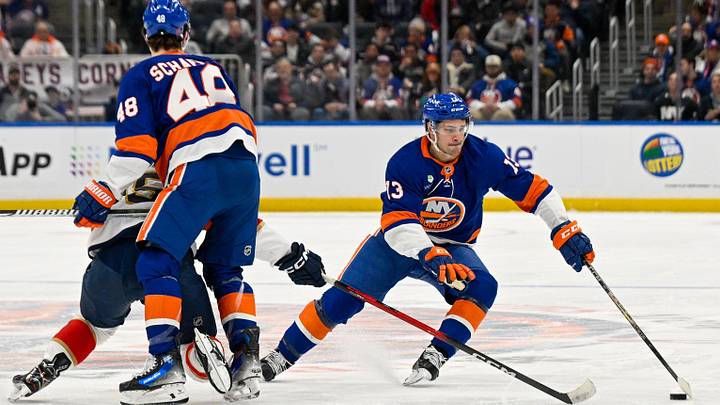Mar 1, 2026; Elmont, New York, USA;  New York Islanders center Mathew Barzal (13) skates around New York Islanders defenseman Matthew Schaefer (48) against the Florida Panthers during the first period at UBS Arena. Mandatory Credit: Dennis Schneidler-Imagn Images