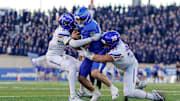 Sep 20, 2025; Colorado Springs, Colorado, USA; Air Force Falcons quarterback Liam Szarka (9) runs the ball against Boise State Broncos defensive back Jeremiah Earby (6) and defensive lineman Max Stege (95) in the second quarter at Falcon Stadium. 