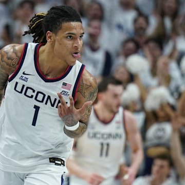 Mar 5, 2025; Storrs, Connecticut, USA; UConn Huskies guard Solo Ball (1) reacts after his three point basket against the Marquette Golden Eagles in the first half at Harry A. Gampel Pavilion. Mandatory Credit: David Butler II-Imagn Images