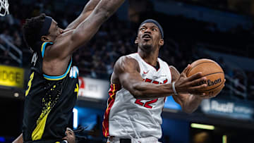 Apr 7, 2024; Indianapolis, Indiana, USA; Miami Heat forward Jimmy Butler (22) shoots the ball while Indiana Pacers forward Pascal Siakam (43) defends in the second half at Gainbridge Fieldhouse. Mandatory Credit: Trevor Ruszkowski-Imagn Images