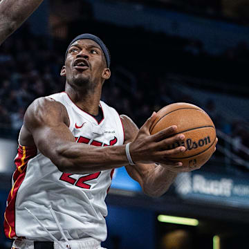 Apr 7, 2024; Indianapolis, Indiana, USA; Miami Heat forward Jimmy Butler (22) shoots the ball while Indiana Pacers forward Pascal Siakam (43) defends in the second half at Gainbridge Fieldhouse. Mandatory Credit: Trevor Ruszkowski-Imagn Images