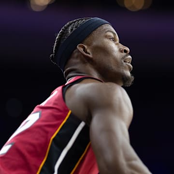 Apr 17, 2024; Philadelphia, Pennsylvania, USA; Miami Heat forward Jimmy Butler (22) lines up a shot against the Philadelphia 76ers during the first quarter of a play-in game of the 2024 NBA playoffs at Wells Fargo Center. Mandatory Credit: Bill Streicher-Imagn Images