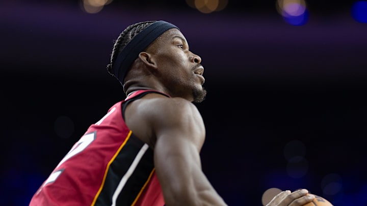 Apr 17, 2024; Philadelphia, Pennsylvania, USA; Miami Heat forward Jimmy Butler (22) lines up a shot against the Philadelphia 76ers during the first quarter of a play-in game of the 2024 NBA playoffs at Wells Fargo Center. Mandatory Credit: Bill Streicher-Imagn Images