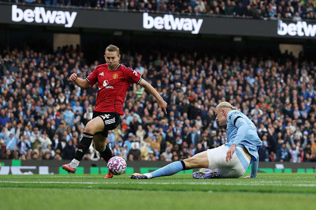 Matthijs de Ligt (left) struggling unsuccessfully to stop Erling Haaland.