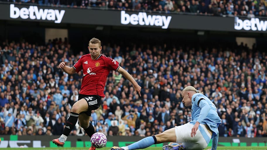 Matthijs de Ligt (left) trying and failing to contain Erling Haaland.