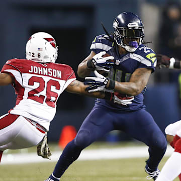 Nov 15, 2015; Seattle, WA, USA; Seattle Seahawks running back Marshawn Lynch (24) rushes against the Arizona Cardinals during the third quarter at CenturyLink Field. Mandatory Credit: Joe Nicholson-Imagn Images