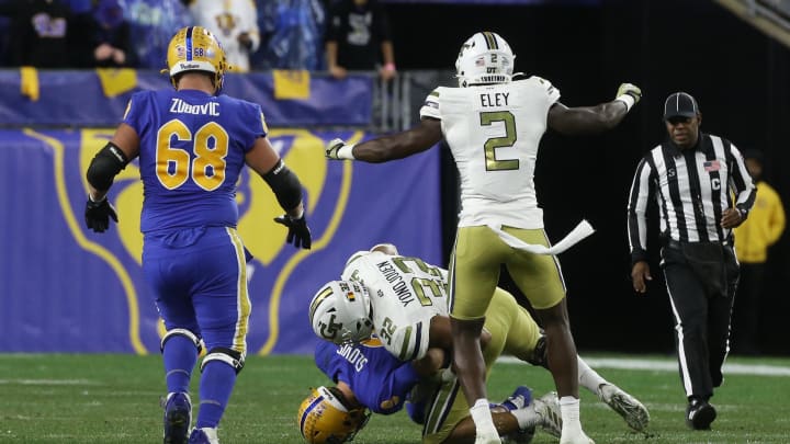 Oct 1, 2022; Pittsburgh, Pennsylvania, USA;  Georgia Tech Yellow Jackets defensive lineman Sylvain Yondjouen (32) sacks Pittsburgh Panthers quarterback Kedon Slovis (9) during the first quarter at Acrisure Stadium. Mandatory Credit: Charles LeClaire-USA TODAY Sports