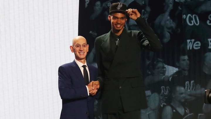 Jun 22, 2023; Brooklyn, NY, USA; Victor Wembanyama poses for photos with NBA commissioner Adam Silver after being selected first by the San Antonio Spurs 