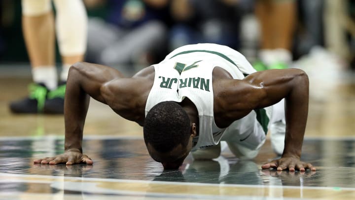 Feb 20, 2018; East Lansing, MI, USA; Michigan State Spartans guard Lourawls Nairn Jr. (11) kisses the court on his senior night during the second half of a game against the Illinois Fighting Illini at Jack Breslin Student Events Center. Mandatory Credit: Mike Carter-USA TODAY Sports