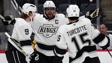 Dec 17, 2024; Pittsburgh, Pennsylvania, USA;  Los Angeles Kings right wing Adrian Kempe (9) celebrates after scoring a goal with center Anze Kopitar (11) and center Alex Turcotte (15) during the first period against the Pittsburgh Penguins at PPG Paints Arena. Mandatory Credit: Charles LeClaire-Imagn Images