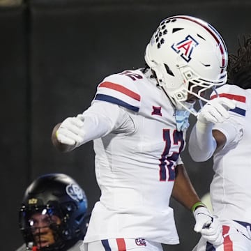 Nov 1, 2025; Boulder, Colorado, USA; Arizona Wildcats wide receiver Javin Whatley (6) celebrates his touchdown with wide receiver Tre Spivey (12) second quarter against the Colorado Buffaloes at Folsom Field. Mandatory Credit: Ron Chenoy-Imagn Images