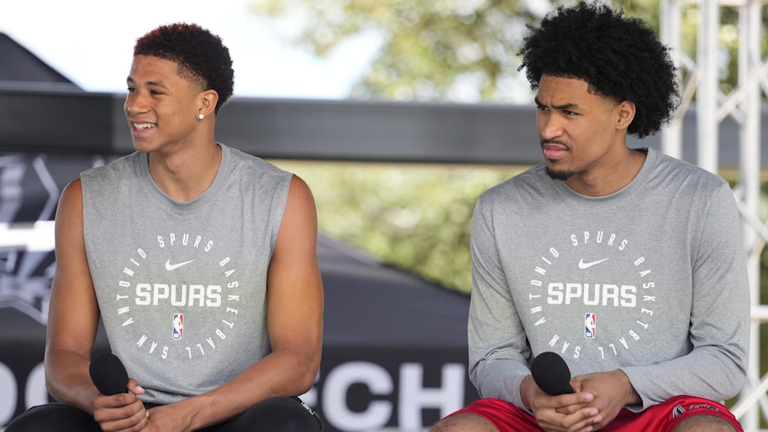 Jun 28, 2025; San Antonio, TX, USA; San Antonio first round draft picks Carter Bryant (left) and Dylan Harper answer questions during the Spurs Family Cookout at Victory Capital Performance Center. Mandatory Credit: Scott Wachter-Imagn Images