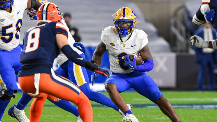 Nov 11, 2023; New York, New York, USA;  Pittsburgh Panthers running back Rodney Hammond Jr. (6) runs the ball defended by Syracuse Orange defensive back Justin Barron (8) during the second half at Yankee Stadium. Mandatory Credit: Dennis Schneidler-USA TODAY Sports