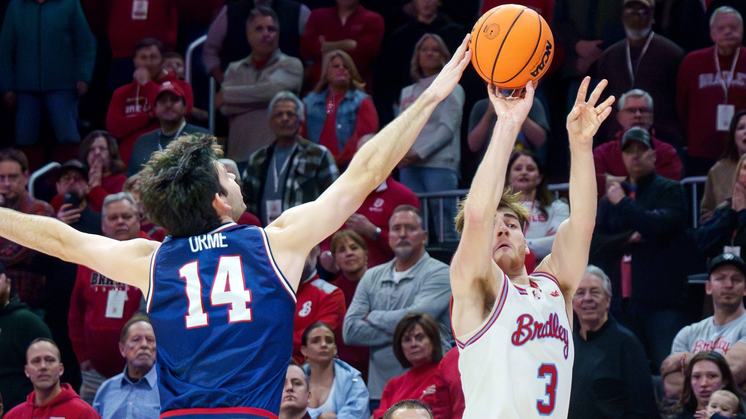 Belmont's Sam Orme makes block on Bradley's Alex Huibregtse to secure a victory in MVCC game.