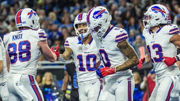 Buffalo Bills players are pictured celebrating during a game. Buffalo Bills players are pictured celebrating during a game.