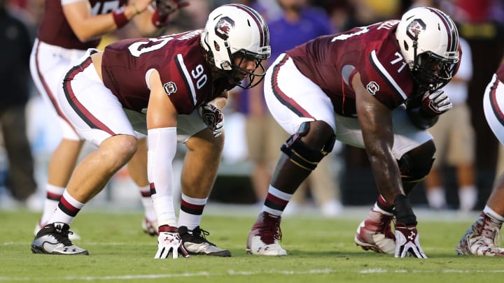 Sep 6, 2014; Columbia, SC, USA;  South Carolina Gamecocks tight end Cody Gibson (90) and offensive tackle Brandon Shell (71) line up during  game action between the South Carolina Gamecocks and East Carolina Pirates at Williams-Brice Stadium. South Carolina wins 33-23 over East Carolina. Mandatory Credit: Jim Dedmon-USA TODAY Sports